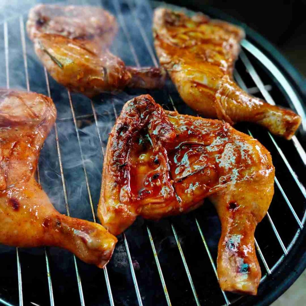 Smoky Gai Yang, an authentic Halal Thai grilled chicken, served with sticky rice—a classic Bangkok street food experience.